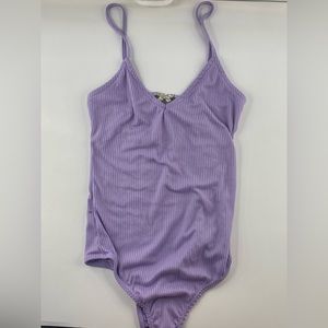Purple body suit with butterfly emblem